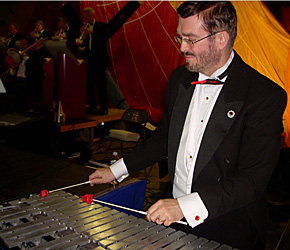 Glen plays with two mallets.