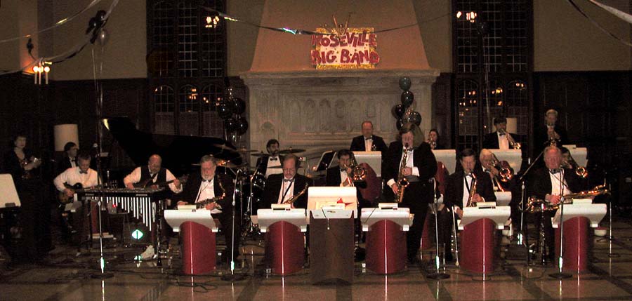 Kay Foster plays an alto sax solo.