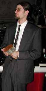 A guest percussionist plays the afuche.