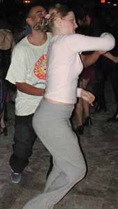 Swing dancers execute a fast spin.