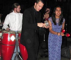 Conga, afuche, and maraca players. Bigger pictures total 62K.