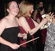 Cowbell and tambourine players. Bigger pictures total 62K.