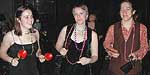 Carleton students play Latin percussion instruments with the band. Bigger picture is 62K.