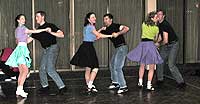 Six dancers perform to a recording of "Rock Around the Clock".