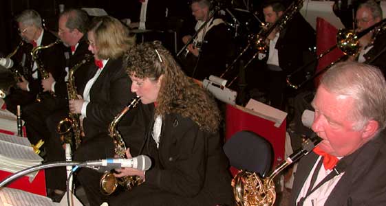 Saxes, trombones, and rhythm section all focus on the music.