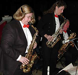Kay and Leslie stand up while playing their duet.