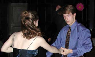 A couple dances a fast swing dance.
