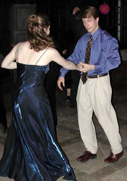 Dancers' eyes meet as they execute the fliud motions of East Coast swing.