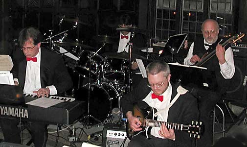 Brian concentrates on his solo as Carl, Mike, and Jim accompany.