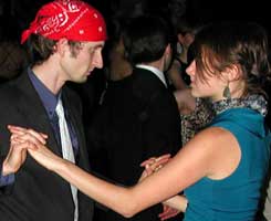 Dancers intently focus on each other.