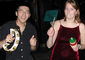 The tambourine and guiro add spice to the rhythm.