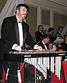 Glen uses two red mallets.
