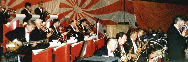 Side view of the band, from Glen out front back through three of the trumpets; Bill plays lead alto.