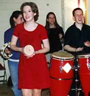 Dancers at Tapestry Folkdance Center played Latin percussion with the band. Bigger picture is 42K.