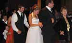 The bridal party and guests do the Bunny Hop.