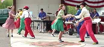 Glen Newton plays vibes while Rhythm & Swing dance. In the foreground: Alice and Terry, Kara and Will; behind them are Cam and Jean, Kyle and Cindy.