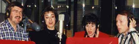 Glen, Diane, Karen, and Kirk sing with headsets on.