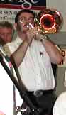 Glen Newton plays a trombone solo.