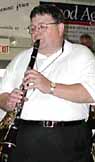 John WIlkes plays a clarinet solo.