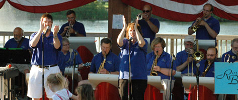 Glen and Karen clap and sing.