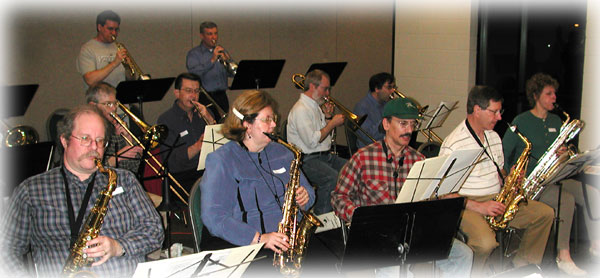 Saxes await their entrance while the brass play.