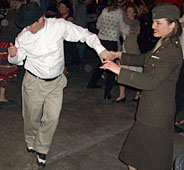 Dancers in civilian and military dress