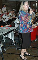 Laura sings while the trombones play backgrounds.