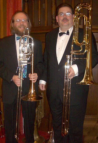Don and Ken stand with their instruments.