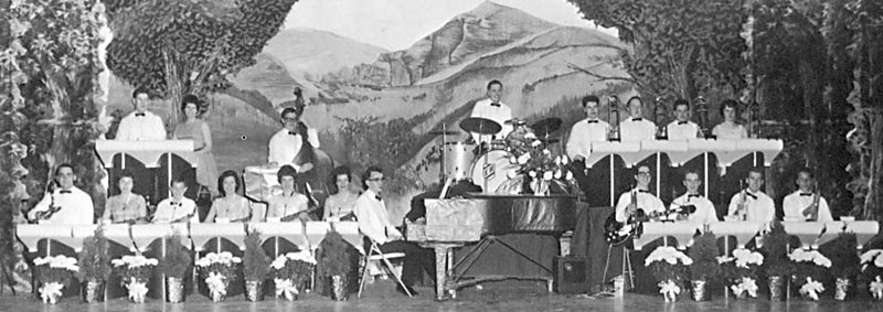 The brass are at the right, saxes and flutes at left, and rhythm section in the middle.