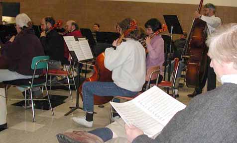 Composer Don Singley follows along on the score.