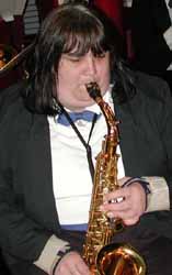 Nancy Veerkamp plays an alto sax solo.