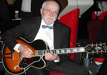 Leigh Anderson with guitar.
