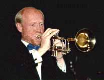 Dan Menken plays a trumpet solo.