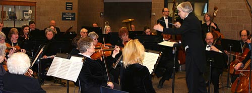 The SACO plays in the community center.