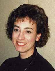 Diane smiles while listening.
