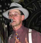 Reeves sings in WWII crooner garb.