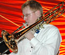 Travis plays bass trombone