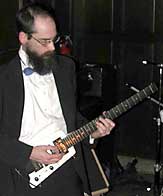 James plays high on the neck of the guitar.