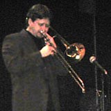 Rich solos into the microphone with his eyes closed.