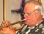 Corky plays trumpet
