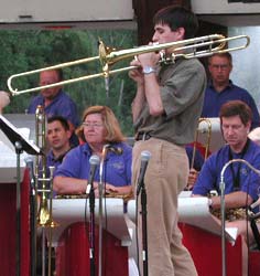 Jesse plays trombone facing left.