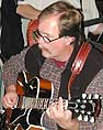 Fred plays guitar