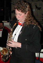 Leslie stands to play the duet.