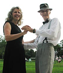 Larry and Betty look down at the camera.