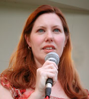 Wendy looks at the audience while singing in the band shell.