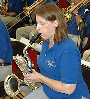 Debbie plays a baritone sax line.