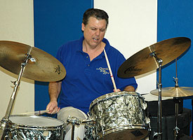 Dave plays on the toms.