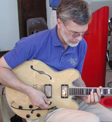 John plays his Epiphone.