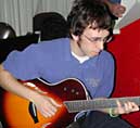 Cory plays guitar