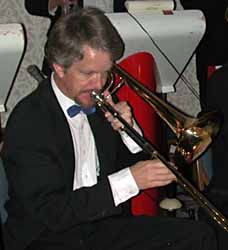 Mark plays in a tux with a Roseville Big Band blue bow tie.